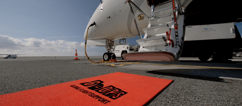G-OPS flight support team servicing a private jet on the tarmac during the G7 Summit